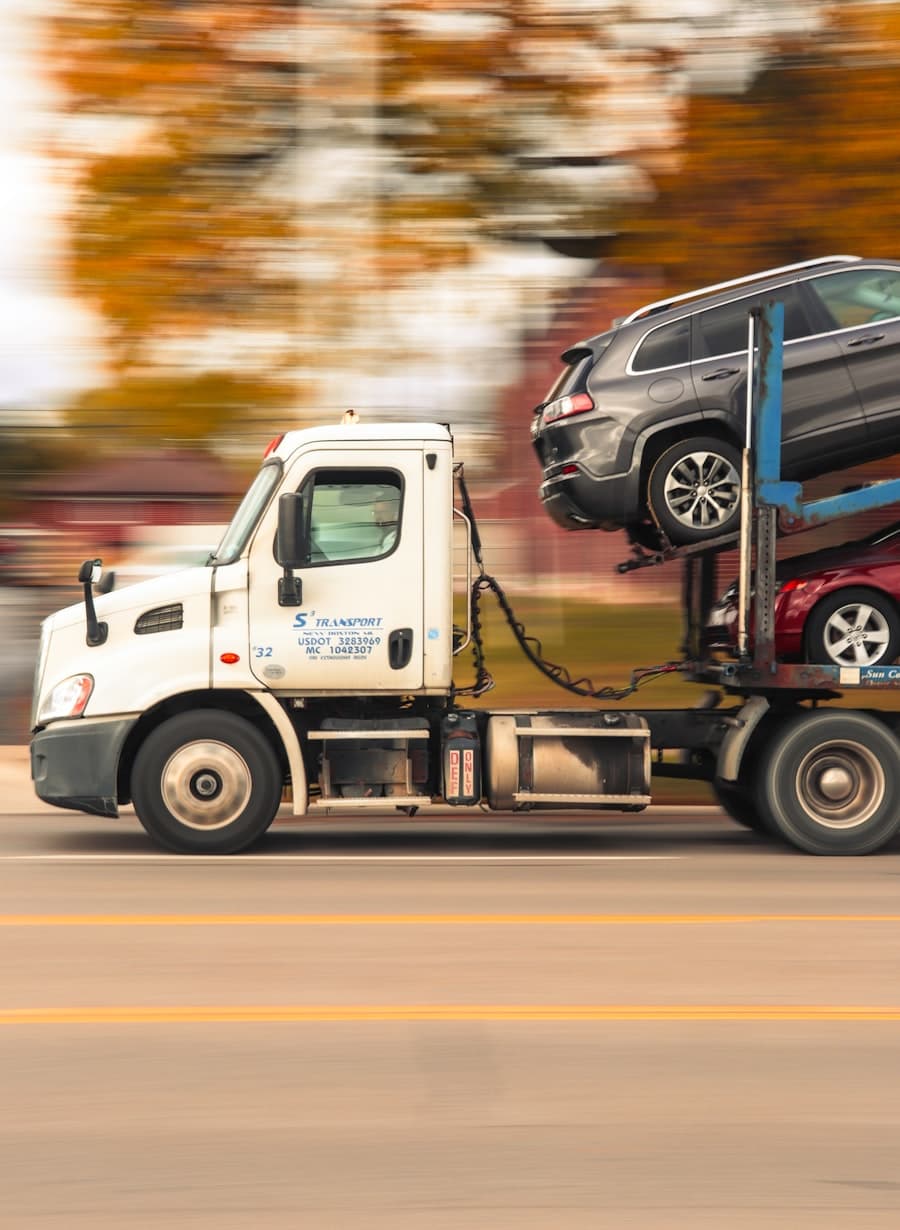 Car carrier truck transporting vehicles on a highway